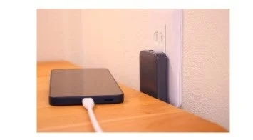 Nitori PD Compatible 65W Slim USB Charger plugged into a wall outlet