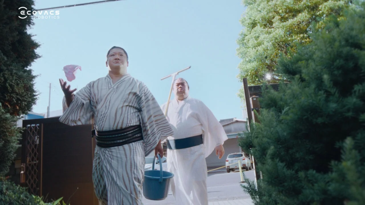Sumo wrestlers with cleaning tools
