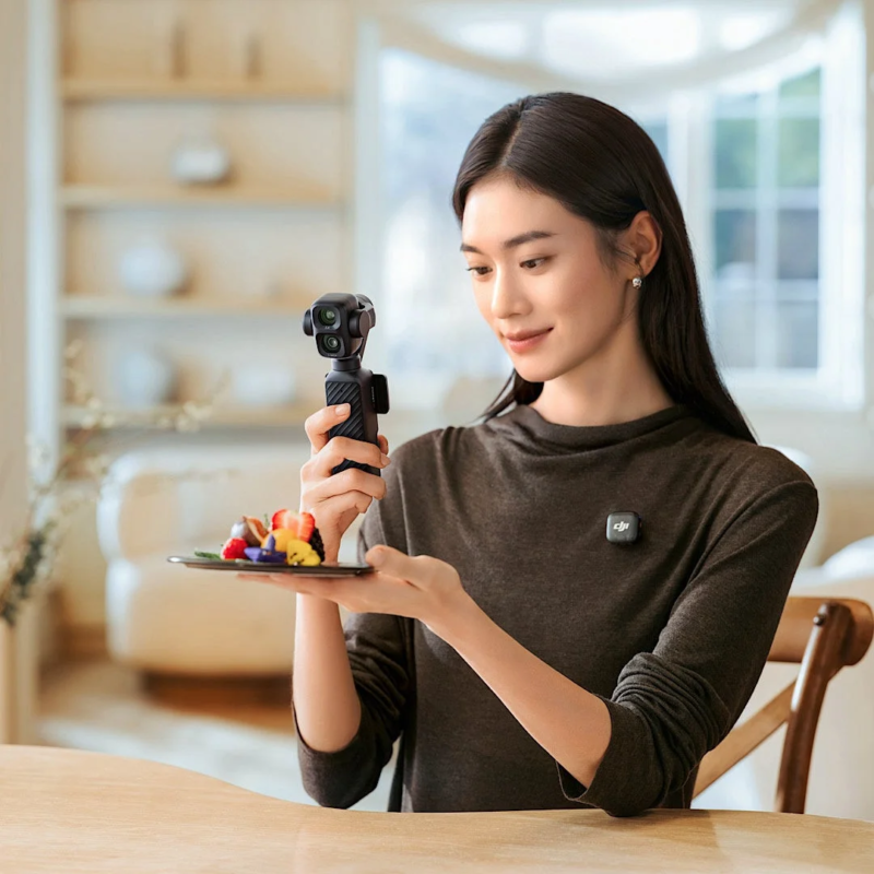 Woman filming dessert with DJI camera