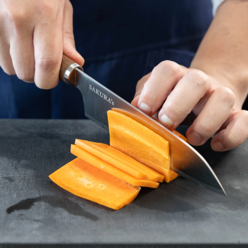 Just Right Knife slicing a carrot on a cutting board