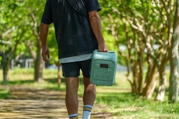 Man carrying AORA 100 mini
