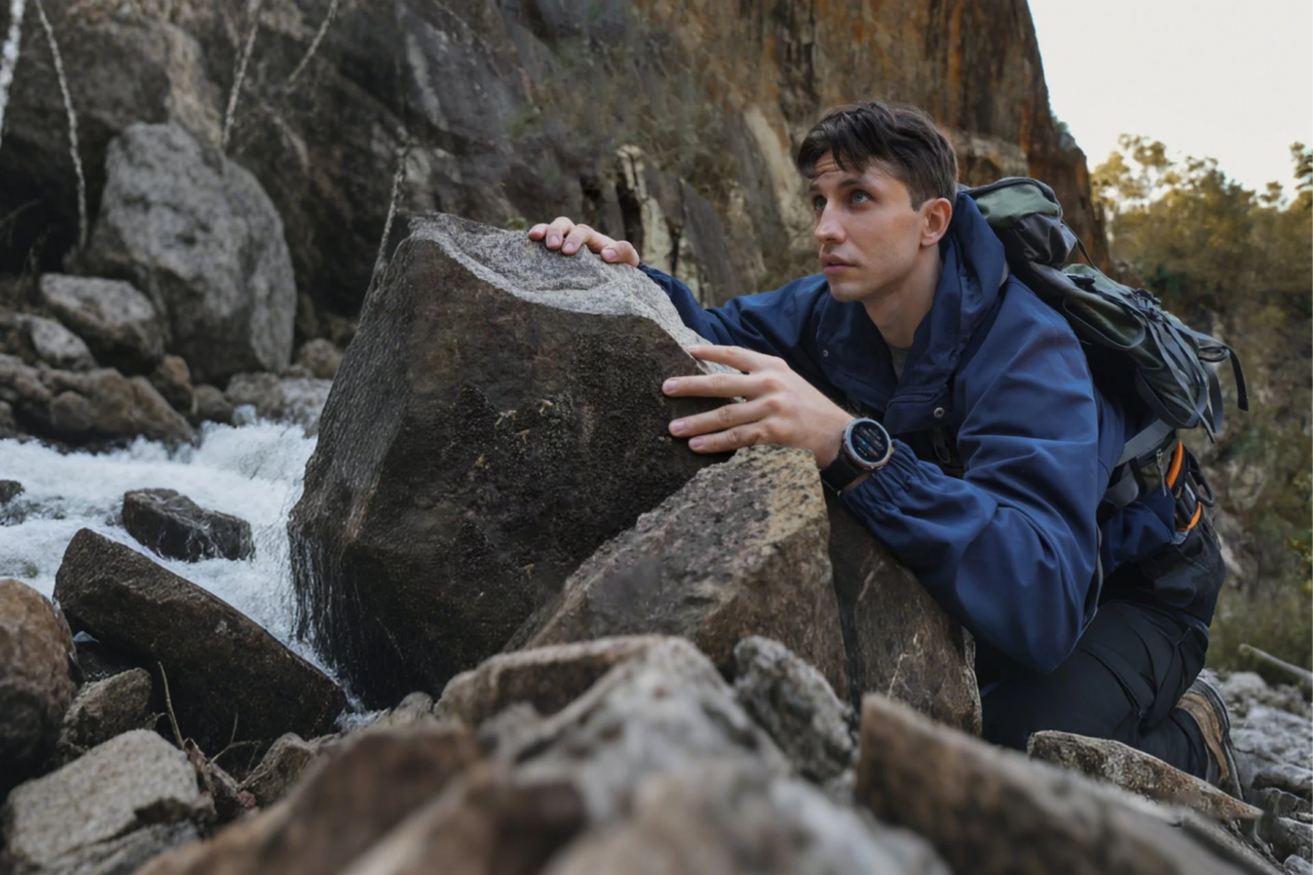 Man hiking by a river