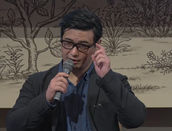 Speaker demonstrating translation feature