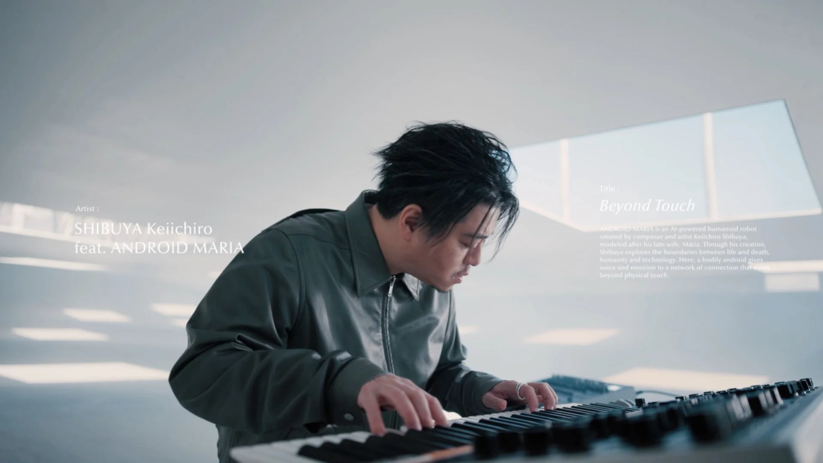 Keiichiro Shibuya playing keyboard with ANDROID MARIA