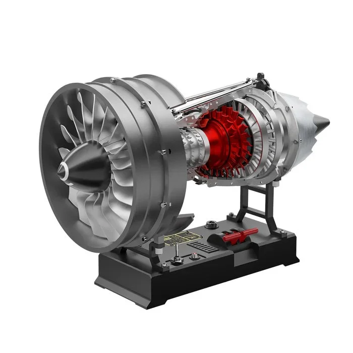 A detailed cutaway model of a jet engine with red internal components.