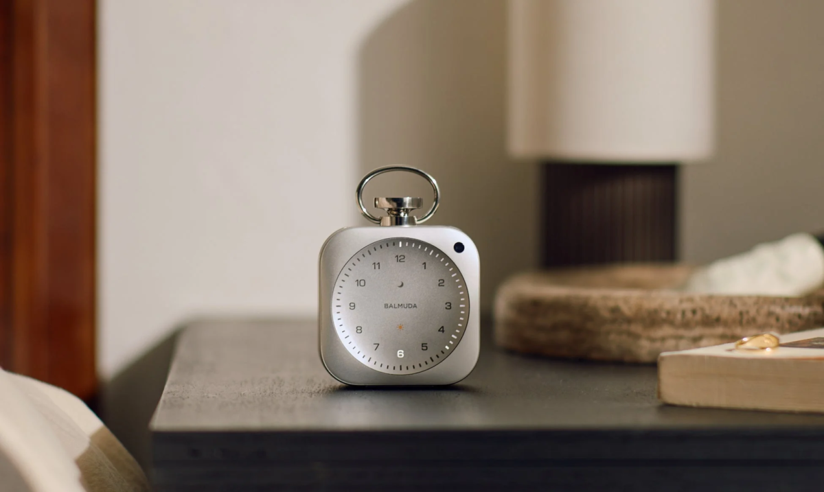BALMUDA The Clock on a bedside table in a modern bedroom