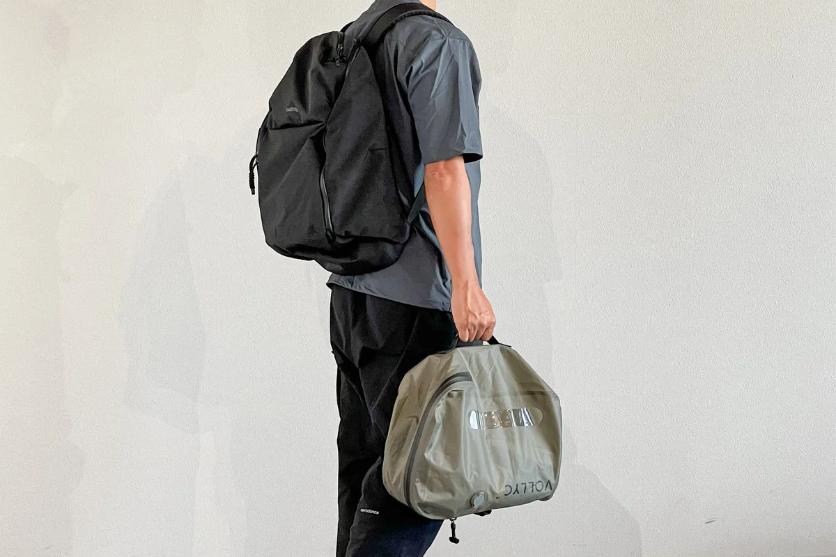 Man with backpack and EZY Compression Bag