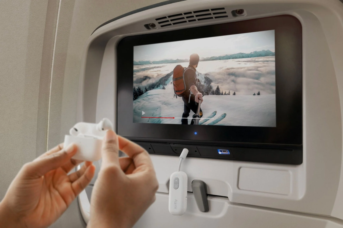 Person using Twelve South AirFly SE on a plane