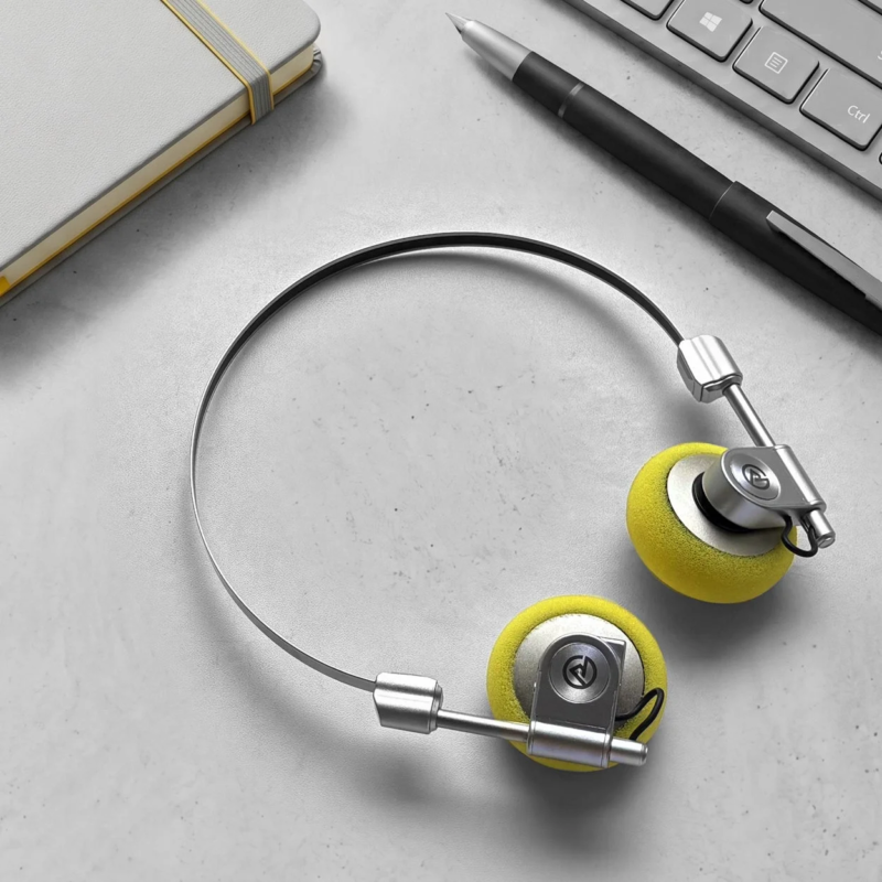 Headphones, notebook, and pen on a desk