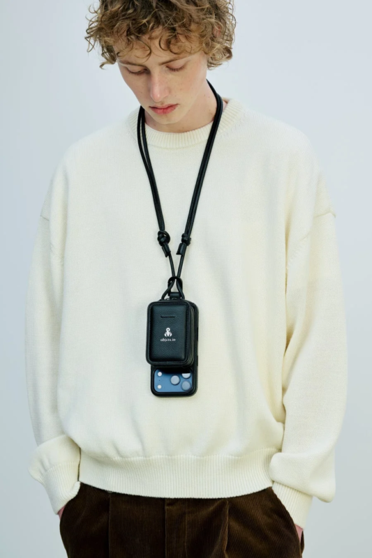 Male model wearing objcts.io x SOPHNET. iPhone case