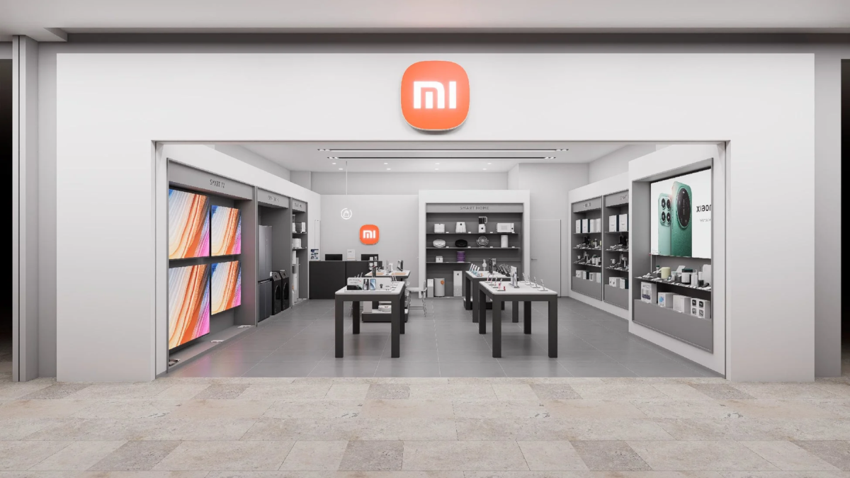 Interior of a Xiaomi store, showcasing smart TVs, smartphones, smart home products, and other electronic devices with the Xiaomi logo prominently displayed.