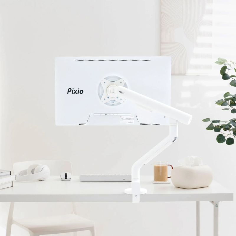White desk setup with Pixio monitor arm