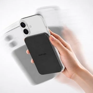 Black mobile battery attached to iPhone
