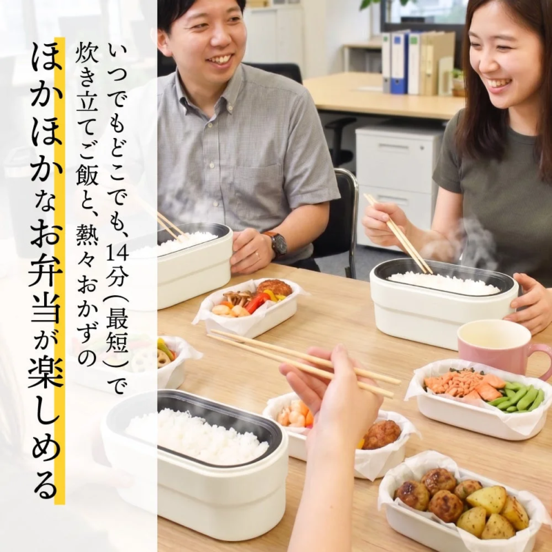 A man and woman enjoying warm packed lunches at the office