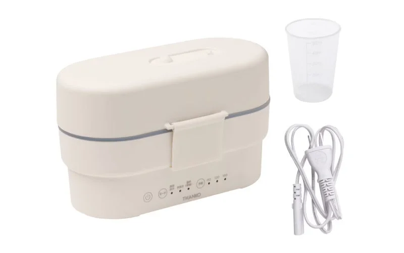 A set of THANKO's portable bento box rice cooker, including the main unit, measuring cup, and power cord.