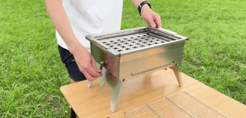 Man assembling a portable grill