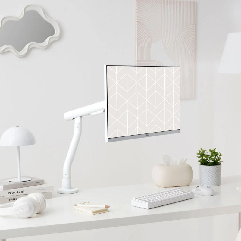 Minimalist white home office with monitor arm