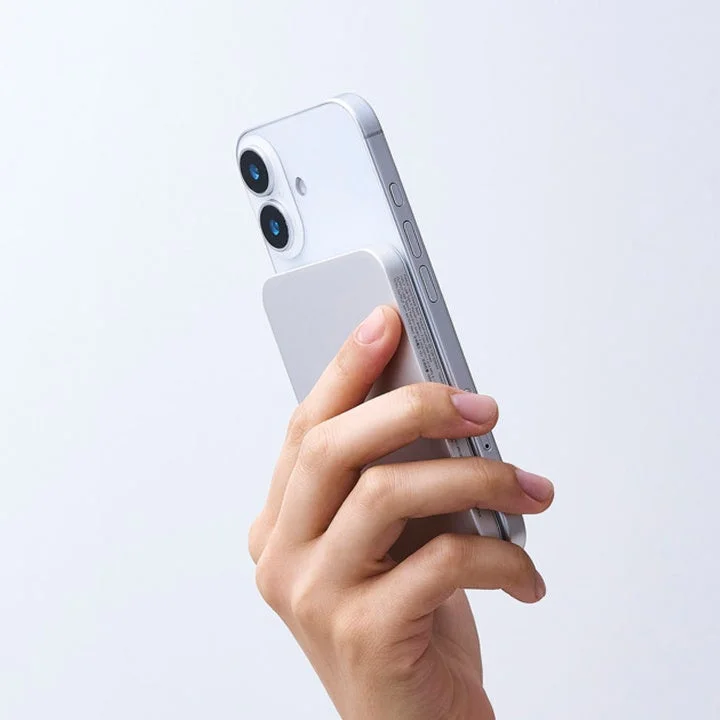 Silver mobile battery attached to iPhone