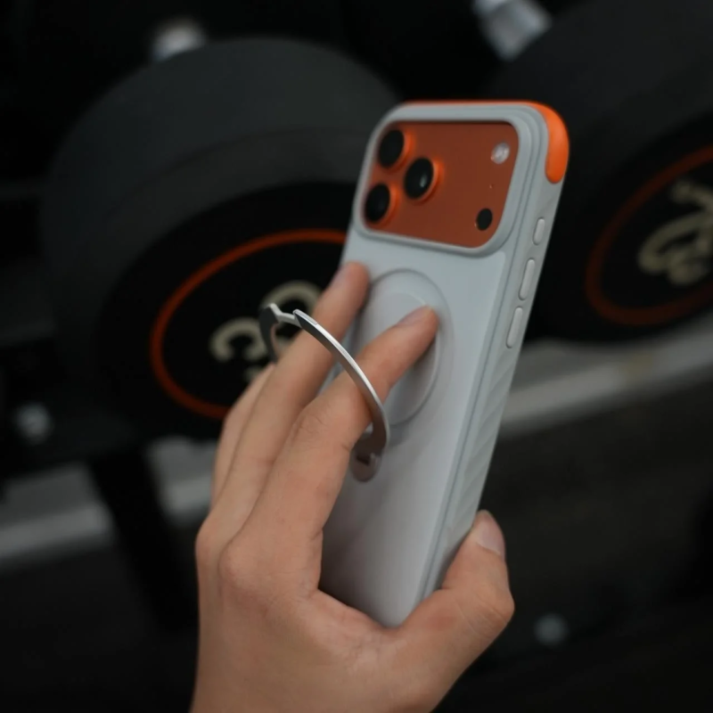 Hand holding iPhone with Ostand Q3 Rugg stand