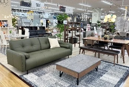 Image of a furniture showroom with sofas, dining sets, and other interior items