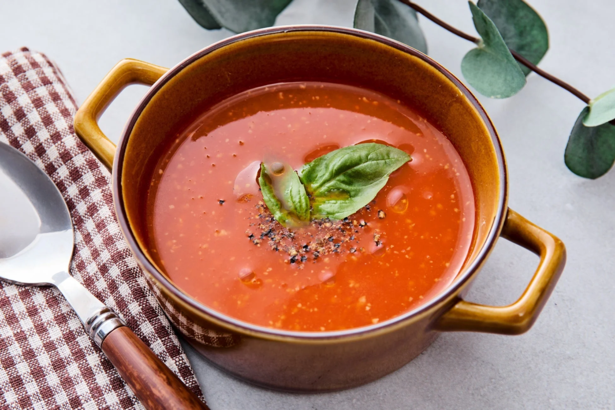 Bowl of tomato soup with basil