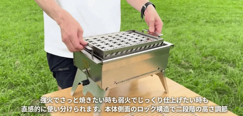 Person adjusting height of portable BBQ grill