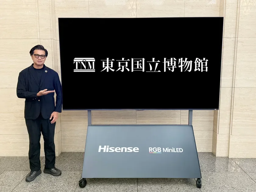 Man next to TNM Hisense RGB MiniLED display