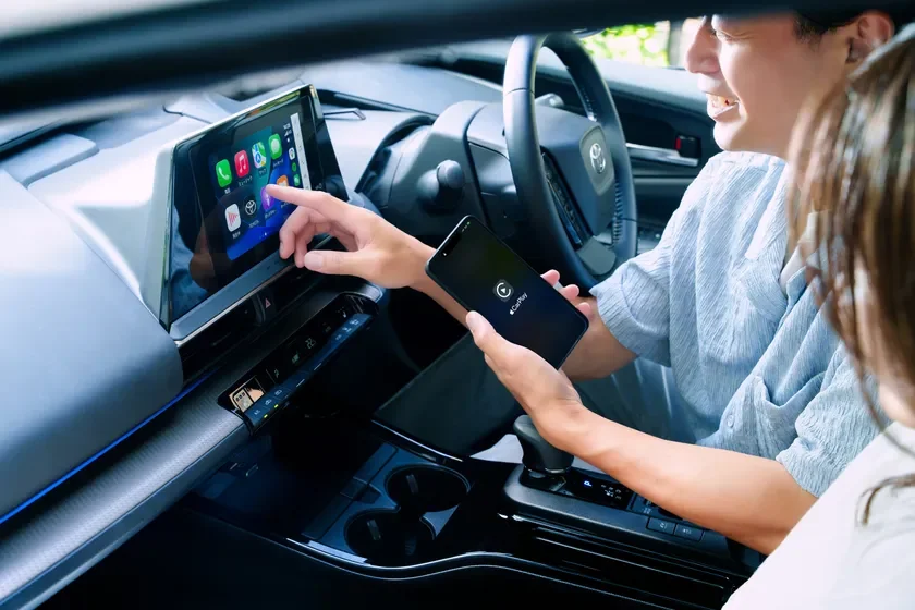 Man Using CarPlay in Car