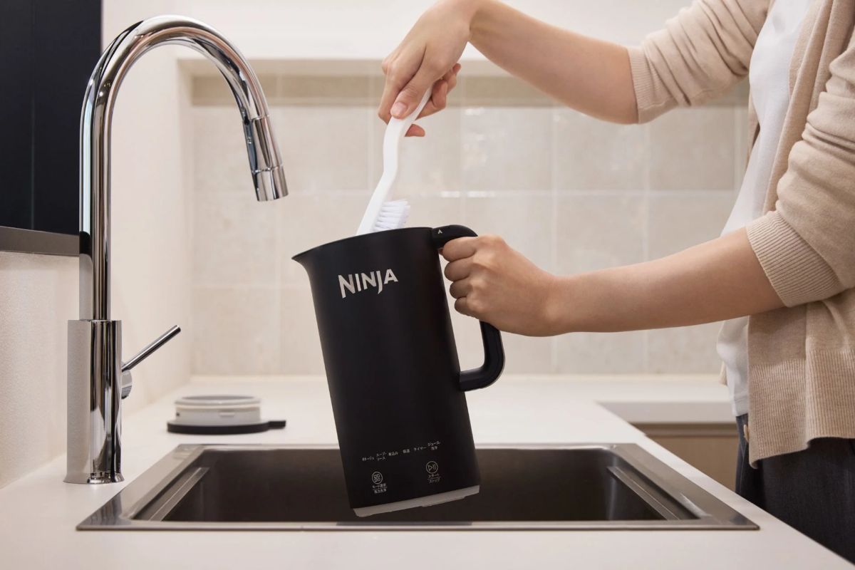 Cleaning the Ninja Soupi pitcher with a brush