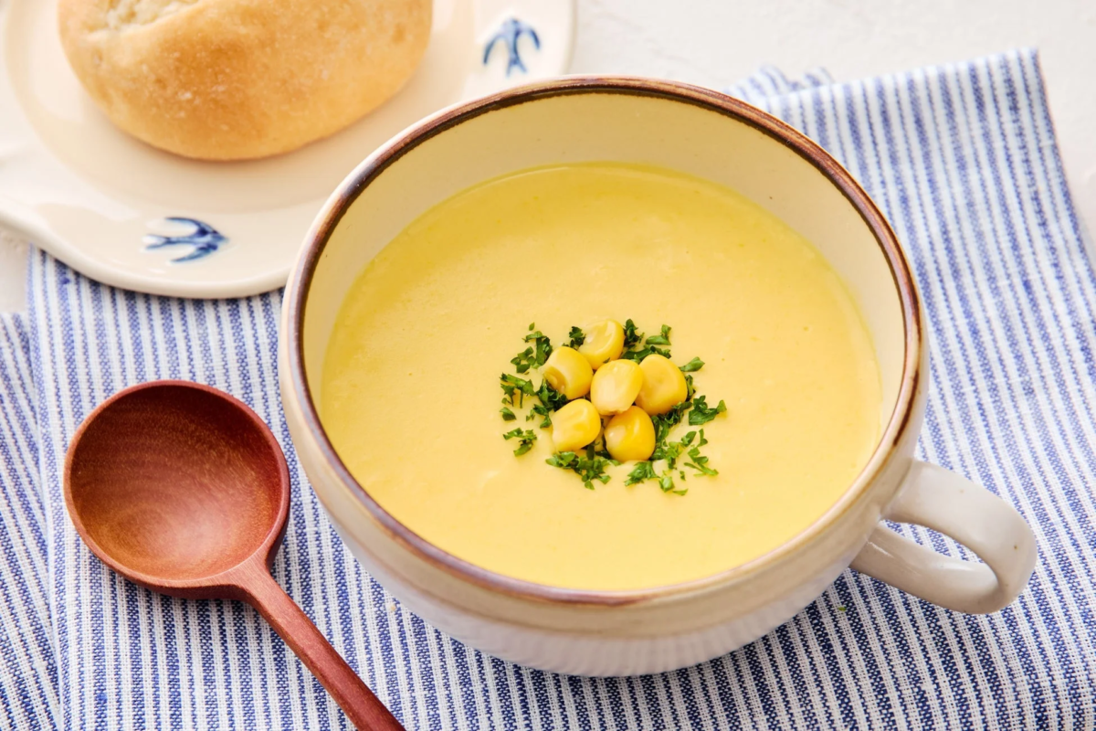 Bowl of corn soup with bread