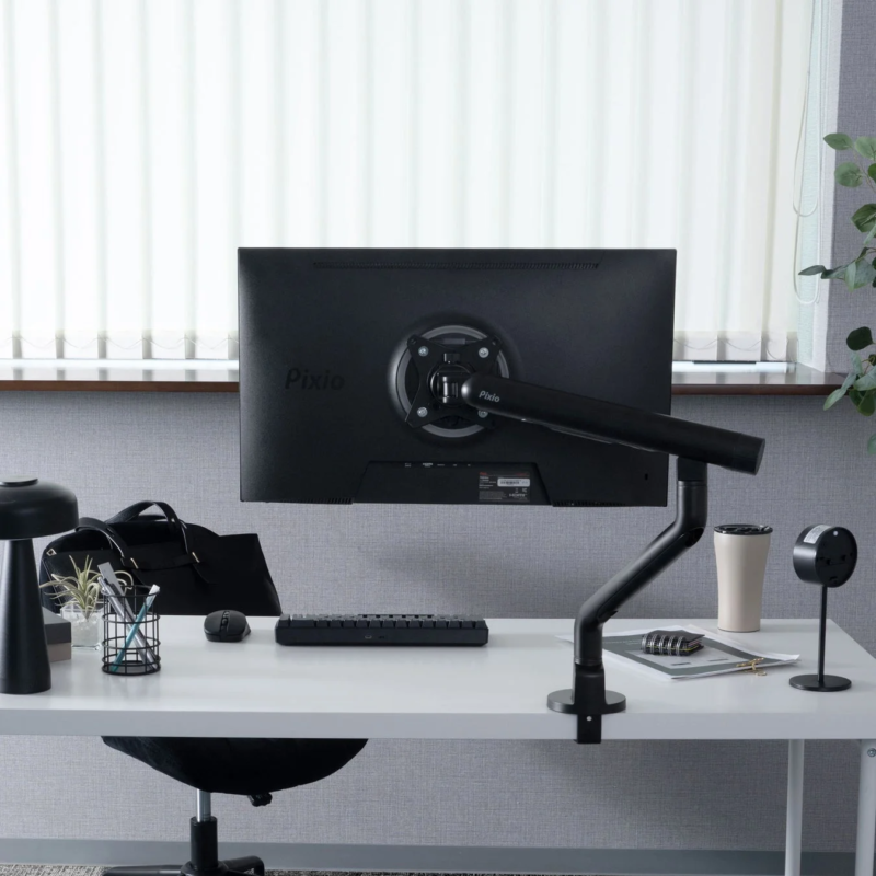 Organized modern workspace with monitor arm