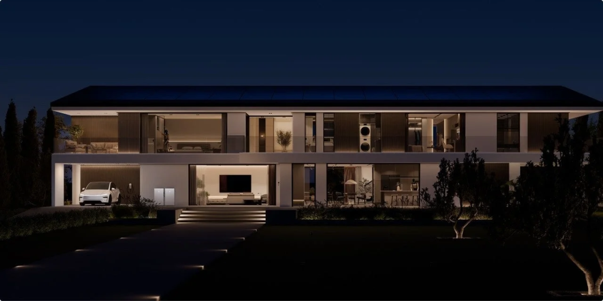 Modern home with Tesla EV charging at night