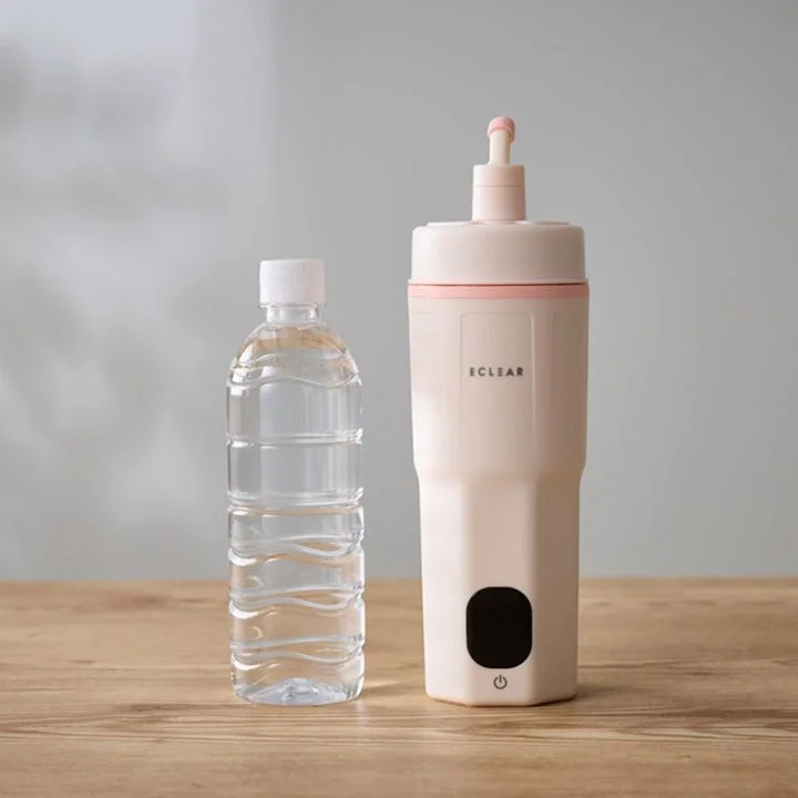 Portable kettle next to a water bottle