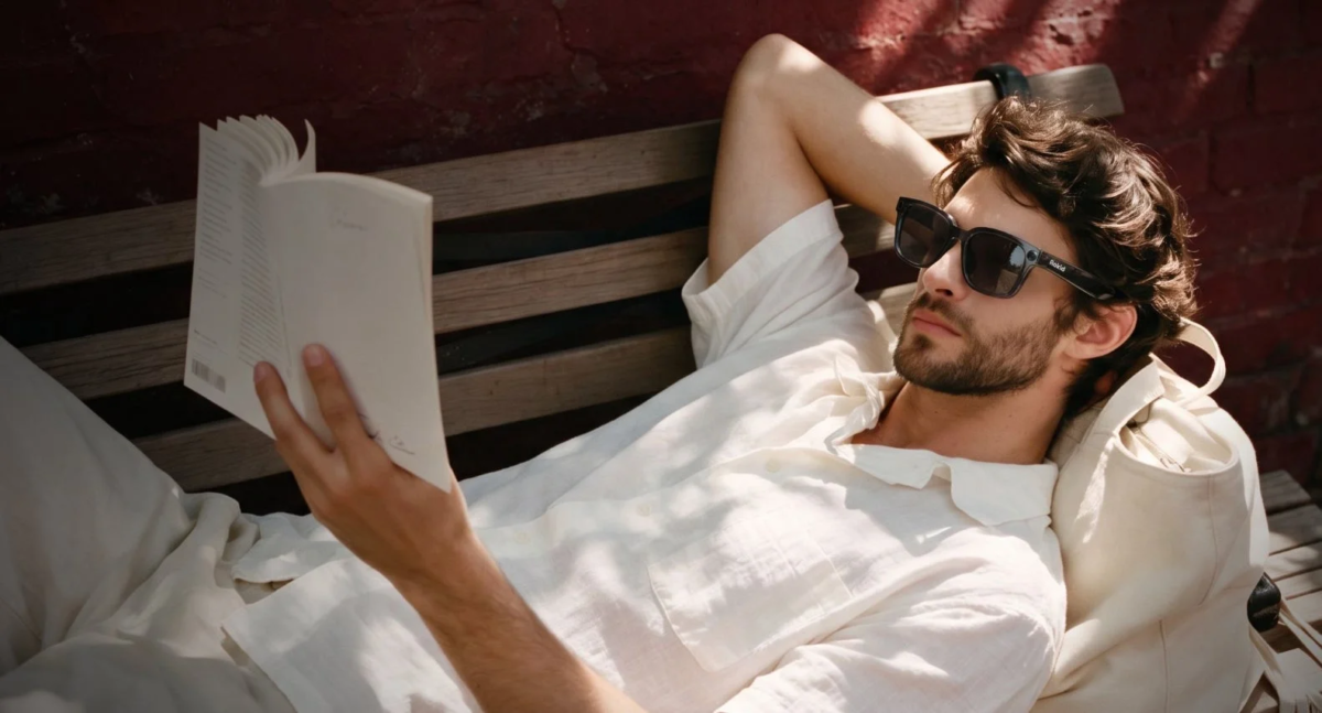 Man reading on a bench, for voice memo feature