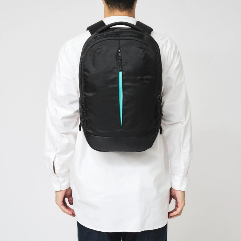 Man with backpack showing mint zipper